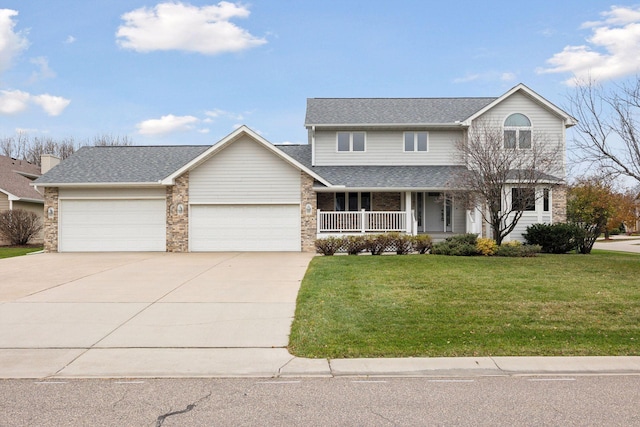 traditional home featuring brick siding, covered porch, concrete driveway, an attached garage, and a front lawn