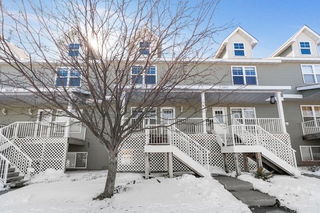 view of front of home featuring stairway and covered porch