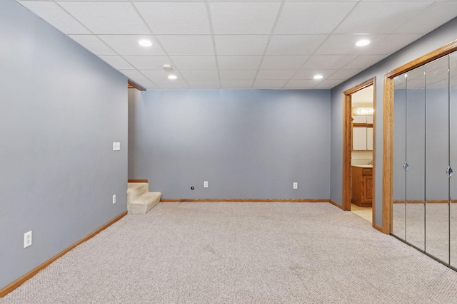 below grade area with stairway, carpet flooring, recessed lighting, and baseboards