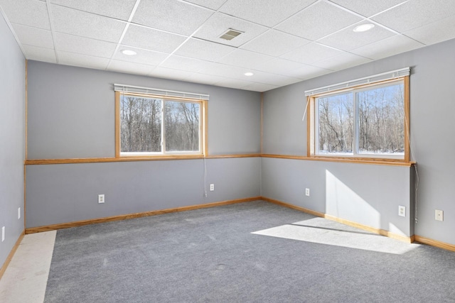 carpeted spare room with recessed lighting, visible vents, baseboards, and a paneled ceiling