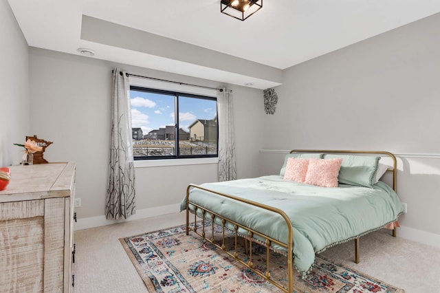 carpeted bedroom with baseboards