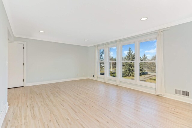 unfurnished room with visible vents, crown molding, baseboards, light wood-style floors, and recessed lighting