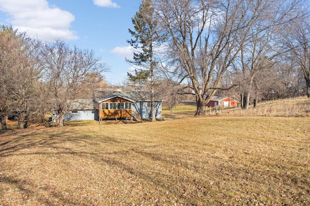 view of yard with a sunroom