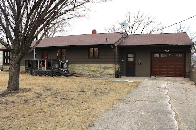 single story home with a chimney, a shingled roof, a garage, stone siding, and driveway