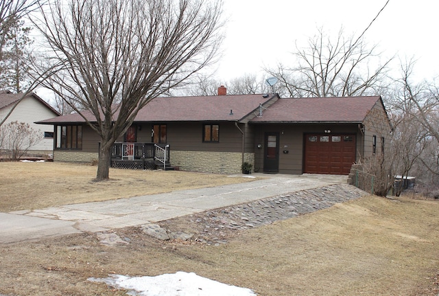 ranch-style house with concrete driveway, stone siding, a chimney, an attached garage, and a porch