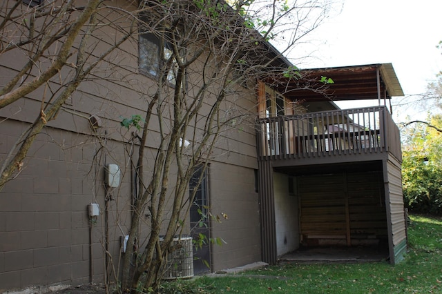 back of house featuring concrete block siding