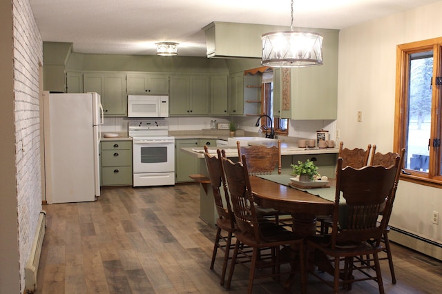 kitchen with white appliances, a sink, light countertops, dark wood finished floors, and green cabinetry