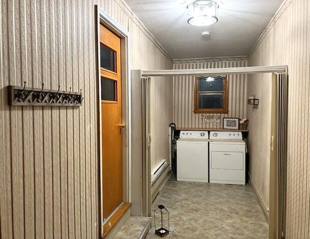 interior space with laundry area, washer and clothes dryer, light floors, and crown molding