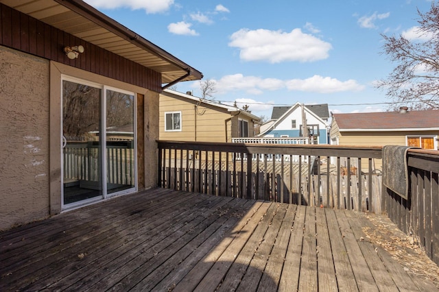 wooden deck featuring a residential view