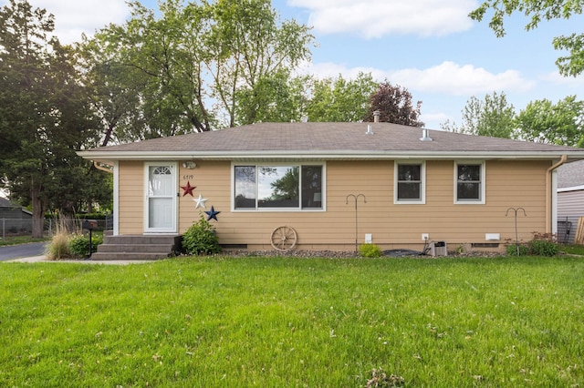 6719 Ewing Ave N, Brooklyn Center, MN 55429 - view of front facade with a front lawn and roof with shingles