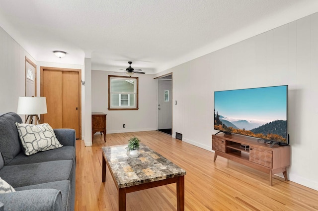 6719 Ewing Ave N, Brooklyn Center, MN 55429 - living room with ceiling fan, light wood-type flooring, and baseboards