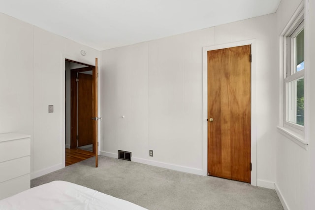 6719 Ewing Ave N, Brooklyn Center, MN 55429 - unfurnished bedroom featuring carpet and baseboards