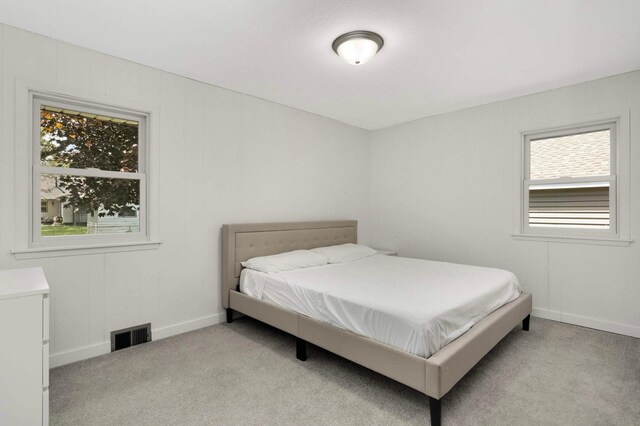 6719 Ewing Ave N, Brooklyn Center, MN 55429 - bedroom featuring light carpet and baseboards