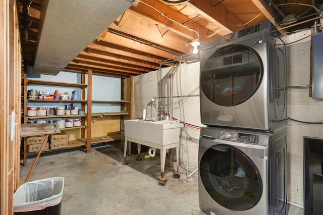 6719 Ewing Ave N, Brooklyn Center, MN 55429 - unfinished basement with stacked washer / drying machine and concrete block wall