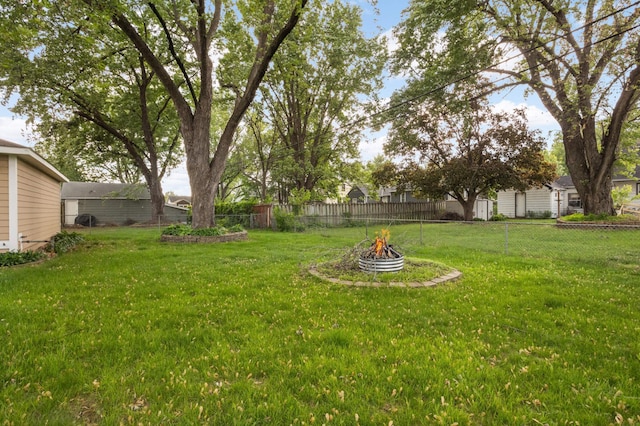 6719 Ewing Ave N, Brooklyn Center, MN 55429 - view of yard featuring an outdoor fire pit
