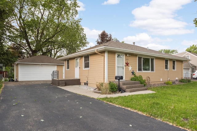 6719 Ewing Ave N, Brooklyn Center, MN 55429 - view of front of property featuring a garage, an outdoor structure, and a front lawn
