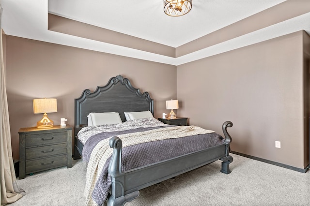 bedroom with baseboards and carpet floors