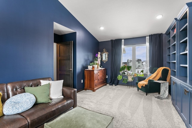 carpeted living room featuring vaulted ceiling, recessed lighting, and baseboards