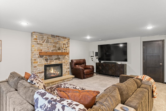 living room with recessed lighting, a fireplace, and carpet floors