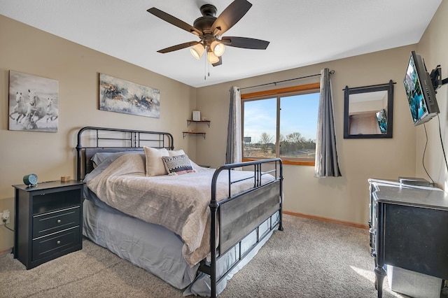 bedroom with light carpet, baseboards, and a ceiling fan