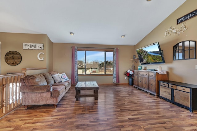 living room featuring lofted ceiling and wood finished floors