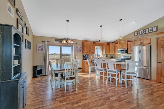 dining area featuring a notable chandelier, light wood-type flooring, visible vents, and recessed lighting