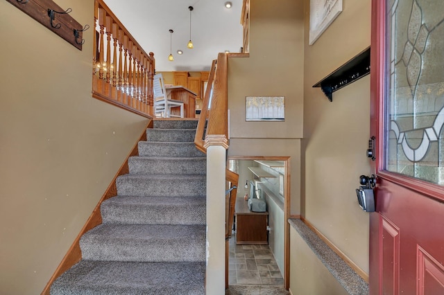 stairway featuring baseboards