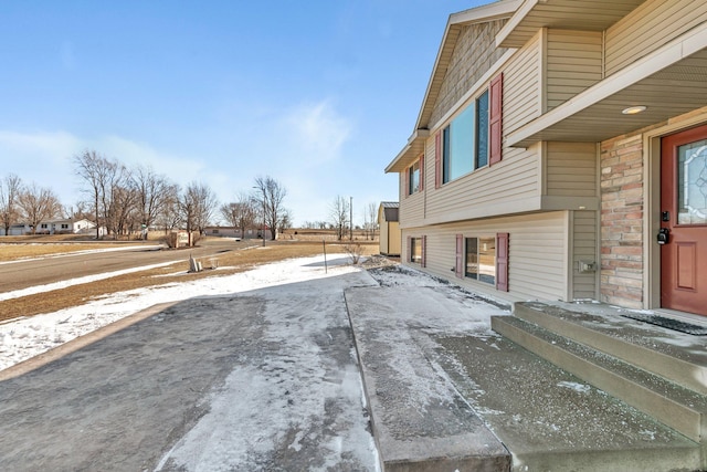 exterior space with concrete driveway