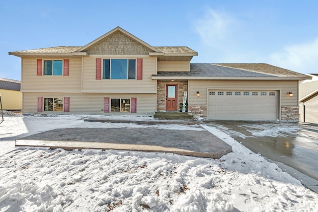 view of front of house with a garage and stone siding