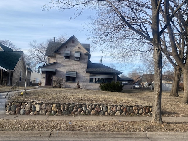 view of front of home with roof with shingles