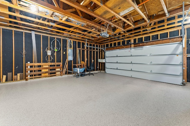 garage with electric panel and a garage door opener