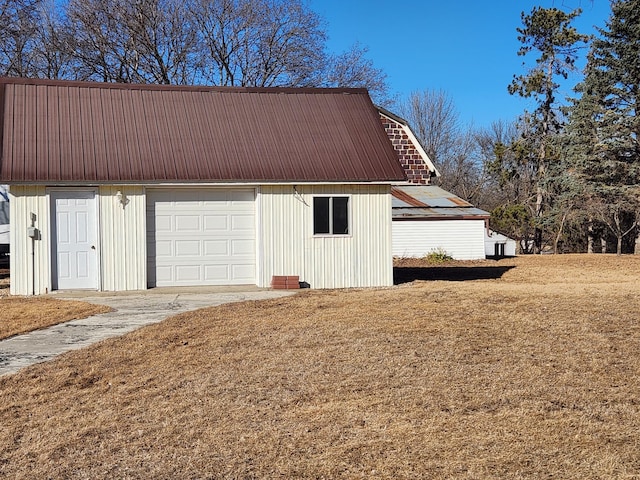 detached garage featuring driveway