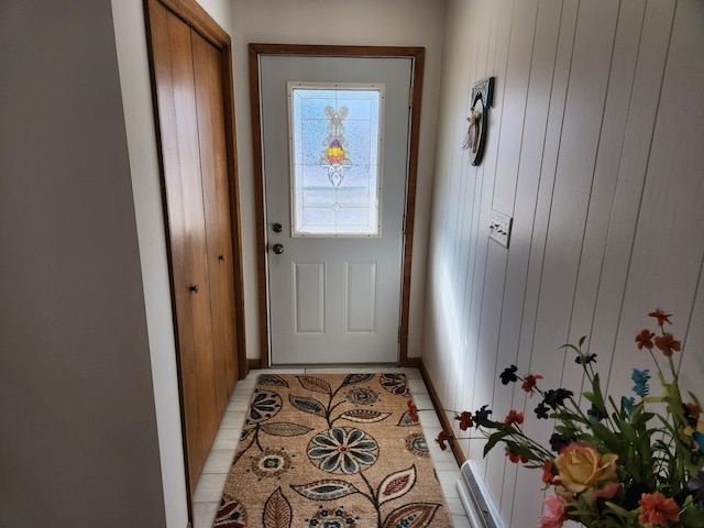 entryway with light tile patterned floors