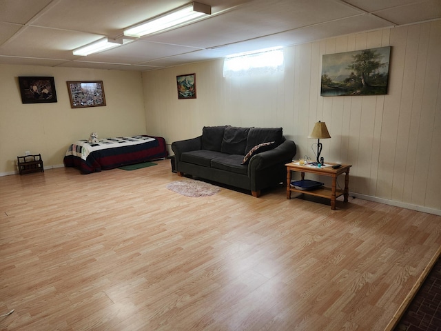 bedroom with baseboards and wood finished floors