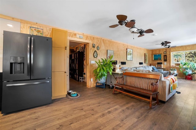 bedroom featuring black fridge and wood finished floors