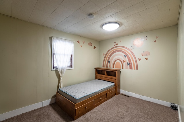 carpeted bedroom with visible vents and baseboards