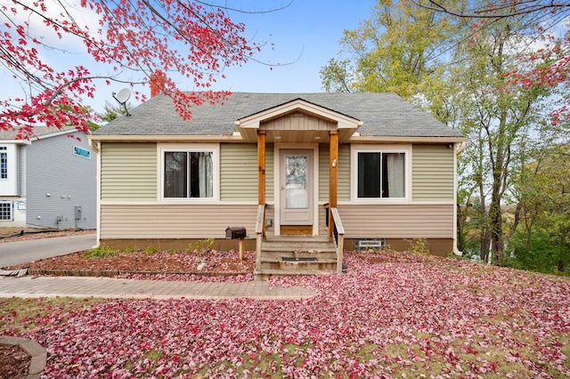 bungalow featuring a shingled roof