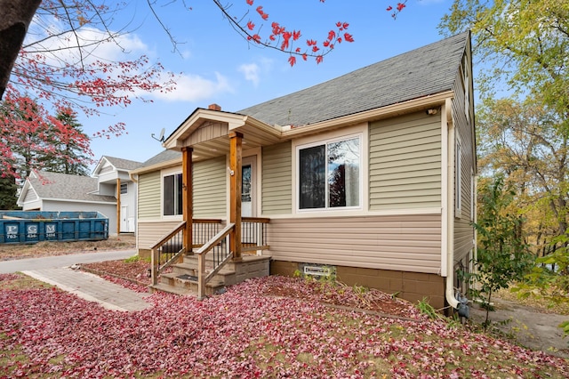 view of front of property with a shingled roof