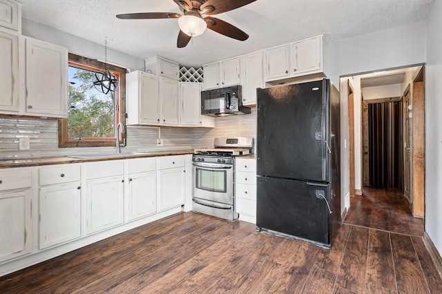 kitchen with black appliances, dark wood-type flooring, white cabinetry, a ceiling fan, and a sink