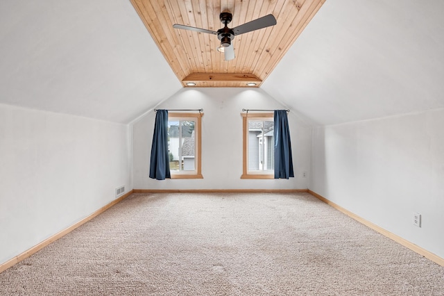 bonus room with visible vents, baseboards, ceiling fan, vaulted ceiling, and carpet flooring