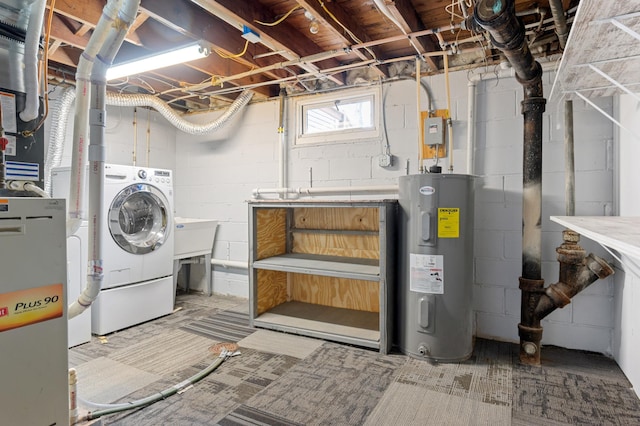 basement featuring washer / clothes dryer and electric water heater