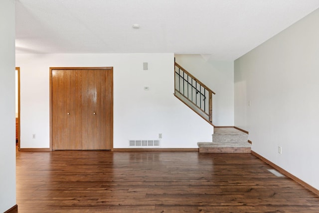 125 96th Ln NE, Blaine, MN 55434 - unfurnished living room featuring wood finished floors, stairway, and baseboards