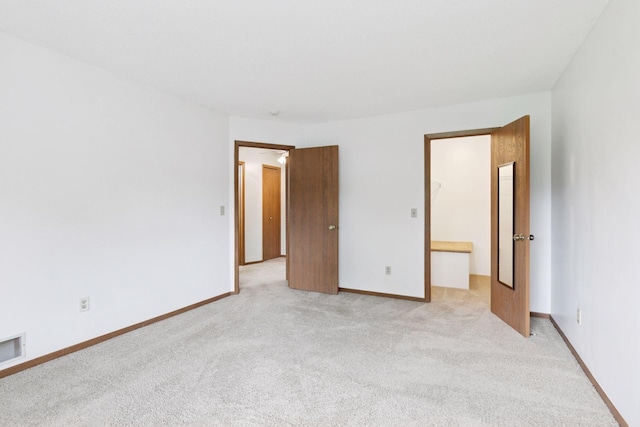 125 96th Ln NE, Blaine, MN 55434 - unfurnished bedroom with light colored carpet and baseboards
