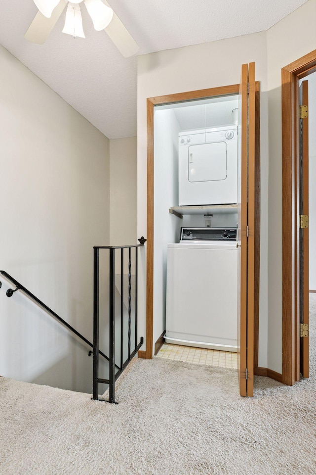 125 96th Ln NE, Blaine, MN 55434 - laundry room with stacked washer / dryer, carpet flooring, a ceiling fan, and baseboards