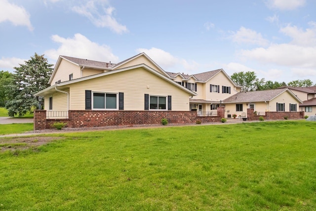 125 96th Ln NE, Blaine, MN 55434 - view of front of house featuring a front lawn and brick siding