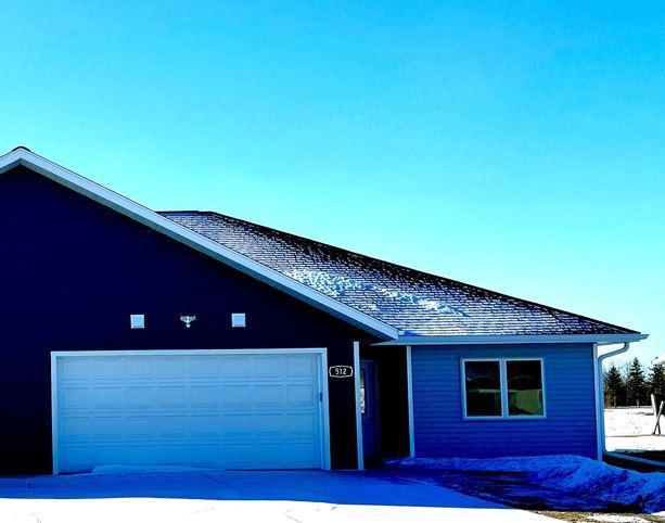 single story home with an attached garage and concrete driveway