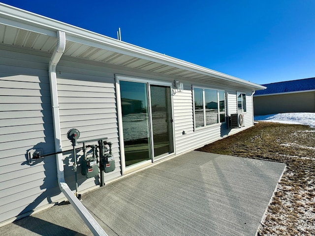 wooden deck featuring ac unit