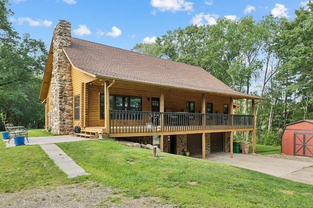 11669 Dellwood Rd, Grant, MN 55082 - view of front of home with a front yard, a garage, a chimney, concrete driveway, and log siding