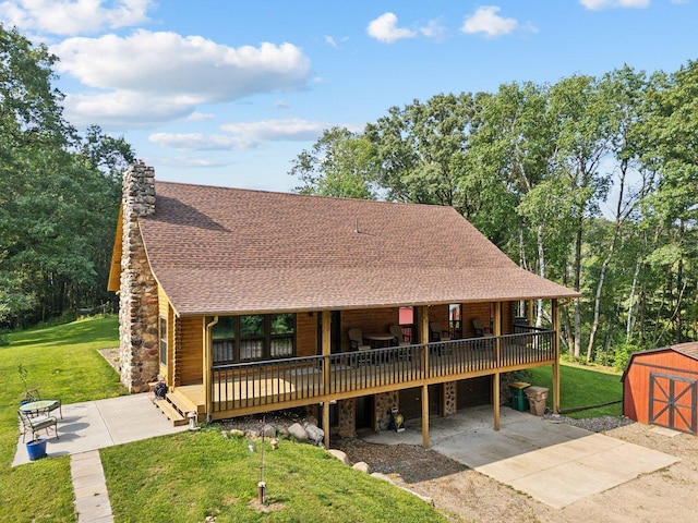 11669 Dellwood Rd, Grant, MN 55082 - view of front of property with concrete driveway, a shingled roof, a front lawn, a wooden deck, and a chimney