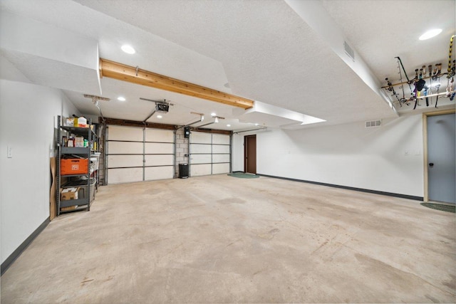 11669 Dellwood Rd, Grant, MN 55082 - garage with a garage door opener, baseboards, and recessed lighting